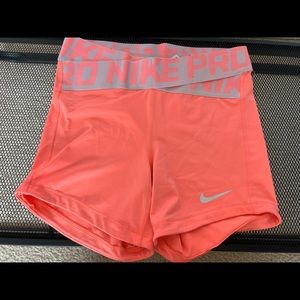 Neon orange Nike Pro shorts